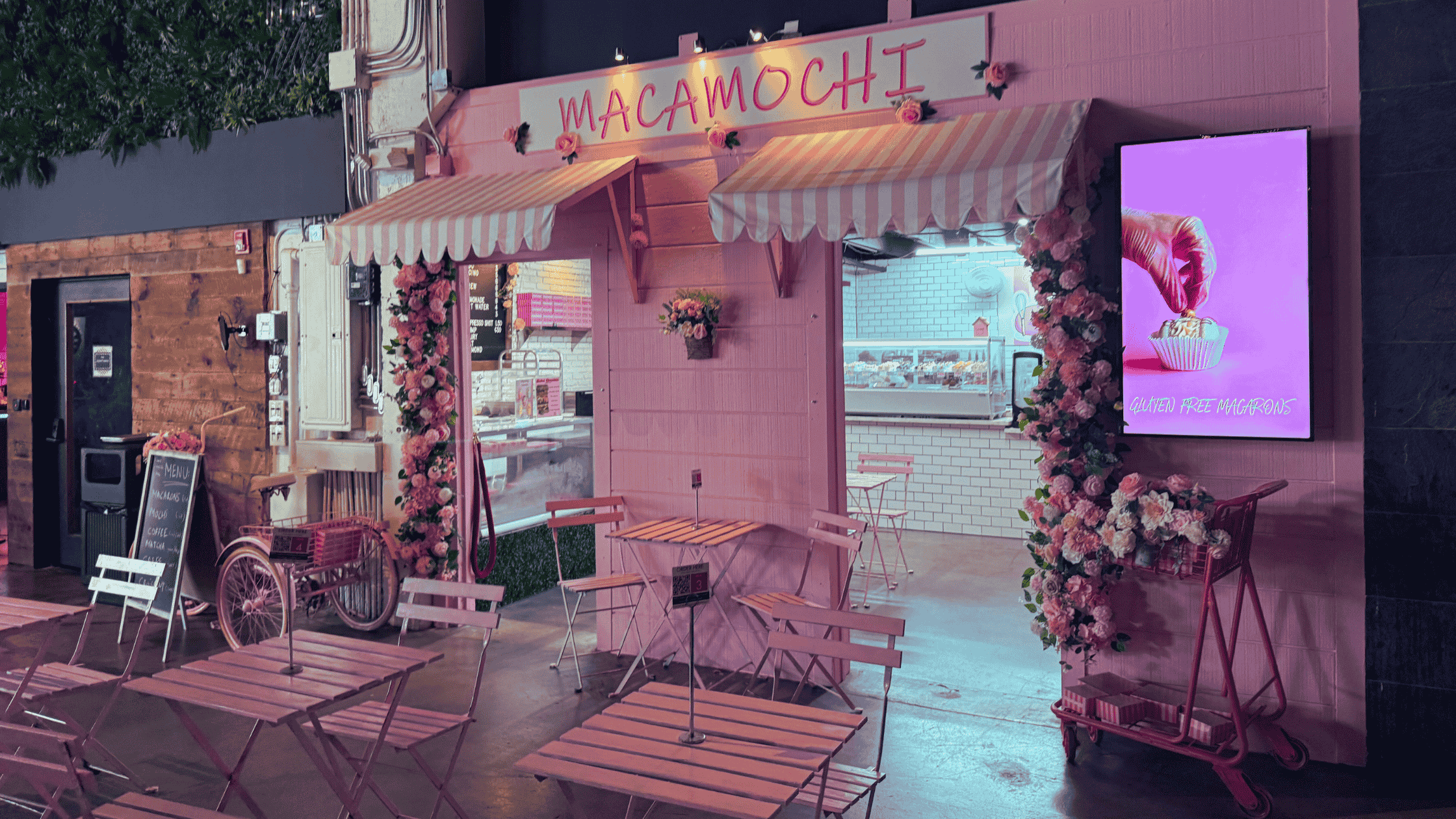 mamamochi storefront, a beautifully pink-decorated setting with a patio-like space.